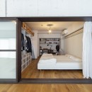 兵庫県Kさん邸：味のある自然素材の空間を見渡して心地よくの写真 寝室+書斎スペース1