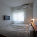 朝霧のマンションリフォーム／一枚の壁で生まれる多様なスペースの写真 寝室