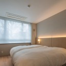 オークと優しい色合いのリノベーションの写真 主寝室